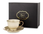 Filiżanka ze spodkiem z porcelany beżowo złota w ozdobnym opakowaniu 250ml 184486